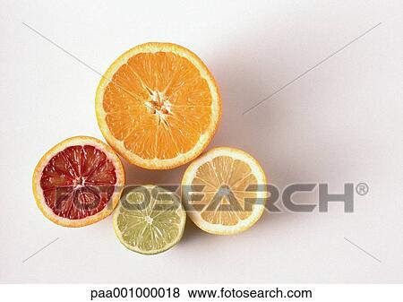 Cross sections of orange, blood orange, lemon, lime, close-up, high angle view, white background View Large Photo Image Stock Photo - Cross sections of orange, blood orange, lemon, lime, close-up, high angle view, white background. Fotosearch