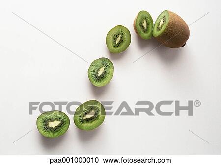 Kiwi and kiwi slices View Large Photo Image Stock Image - Kiwi and kiwi slices. Fotosearch