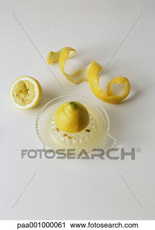 Lemon on lemon press and lemon peel View Large Photo Image Stock Image - Lemon on lemon press and lemon peel. Fotosearch