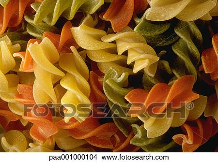 Picture - pasta, green, yellow, orange, delicatessen, product, produce. Fotosearch