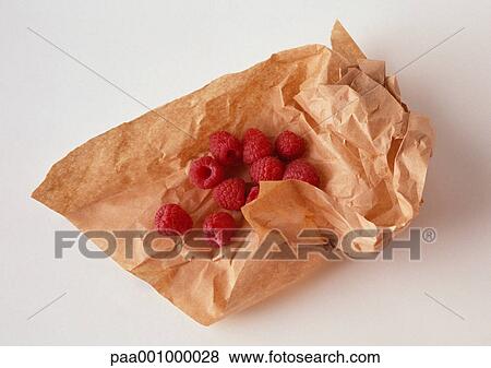 Raspberries on brown paper, close-up View Large Photo Image Stock Photo - Raspberries on brown paper, close-up. Fotosearch