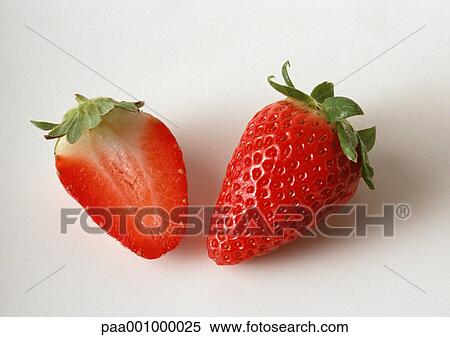 Strawberry and strawberry half, close-up View Large Photo Image Stock Photography - Strawberry and strawberry half, close-up. Fotosearch