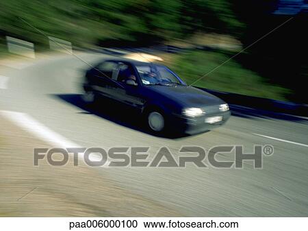 Car travelling around a curved road, blurry. View Large Photo Image Stock Image - Car travelling around a curved road, blurry.. Fotosearch