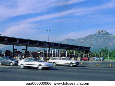 Cars leaving tollbooths View Large Photo Image Stock Photograph - Cars leaving tollbooths. Fotosearch
