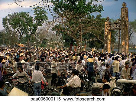 Stock Photography - Crowded scene in Vietnam, people on bicycles.. Fotosearch