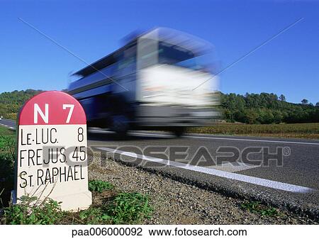 Fast moving vehicle on road, signs for locations in South France. View Large Photo Image Stock Image - Fast moving vehicle on road, signs for locations in South France.. Fotosearch