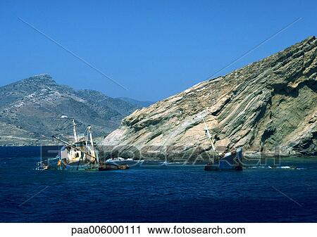 Stock Image - Greece, fishing boats in water.. Fotosearch