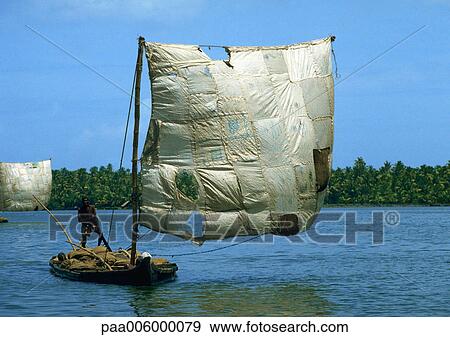 India, person on raft with patchwork sail View Large Photo Image Stock Photo - India, person on raft with patchwork sail. Fotosearch