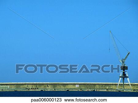 Stock Image - Jetty with drilling station.. Fotosearch
