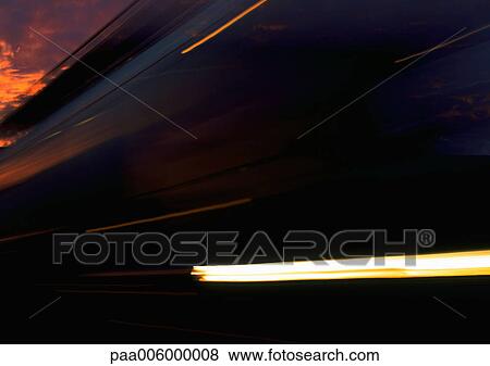 Stock Photo - Light trails at night, blurry.. Fotosearch
