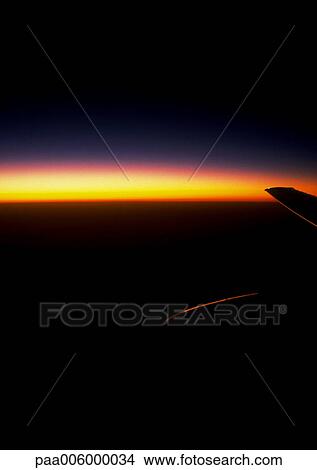 Sunset view of sky from plane. View Large Photo Image Picture - Sunset view of sky from plane.. Fotosearch