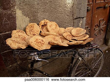 Syria, pita bread being sold, placed on bicycle. View Large Photo Image Stock Photograph - Syria, pita bread being sold, placed on bicycle.. Fotosearch