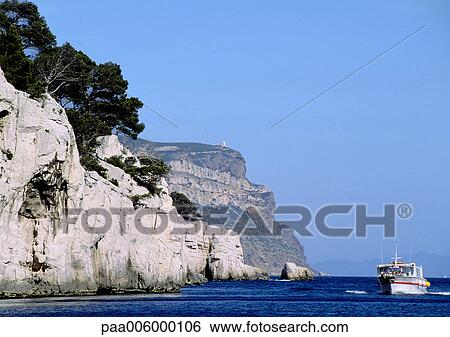 Yacht next to cliff. View Large Photo Image Stock Photograph - Yacht next to cliff.. Fotosearch