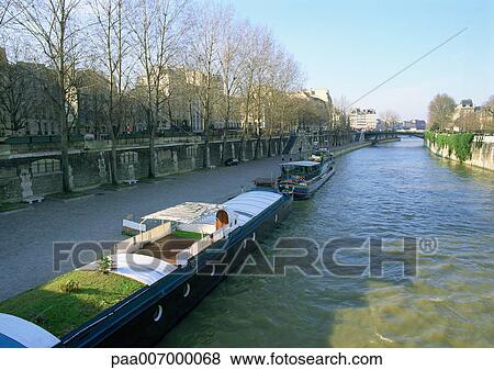 Stock Photo - France, Paris, barges in River Seine. Fotosearch