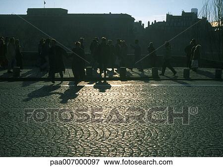 France, Paris, cobblestone street, silhouettes of people walking on sidewalk View Large Photo Image Stock Photo - France, Paris, cobblestone street, silhouettes of people walking on sidewalk. Fotosearch