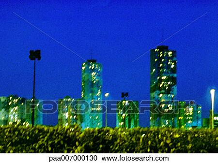 Stock Image - France, Paris, highrise aparment buildings at night. Fotosearch