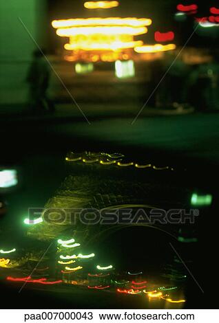 Stock Image - France, Paris, lights and reflection of Eiffel Tower at night. Fotosearch