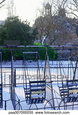 Stock Photography - France, Paris, park in snow. Fotosearch