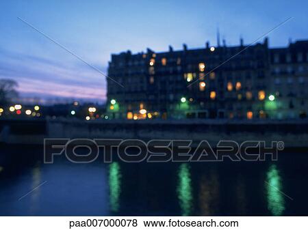 Stock Photo - France, Paris, River Seine at dusk. Fotosearch