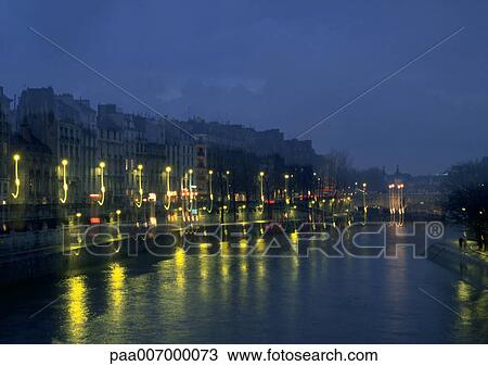 Stock Image - France, Paris, River Seine at night. Fotosearch