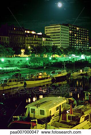 Stock Photo - France, Paris, River Seine at night. Fotosearch