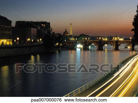 Stock Photograph - France, Paris, River Seine at night. Fotosearch