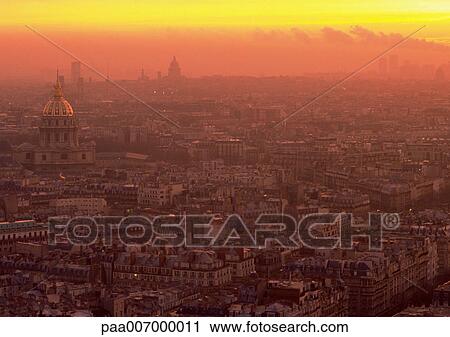 Stock Image - France, Paris, rooftops at sunrise. Fotosearch