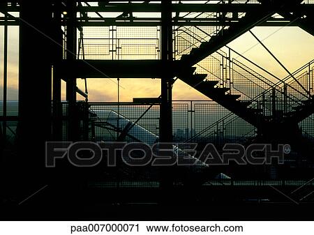 Stock Image - France, Paris, stairs of Pompidou center at sunrise. Fotosearch