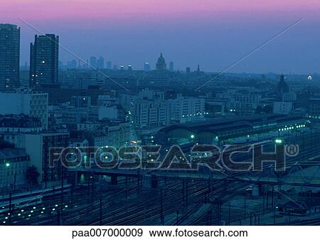 Stock Photo - France, Paris, train station at dusk. Fotosearch