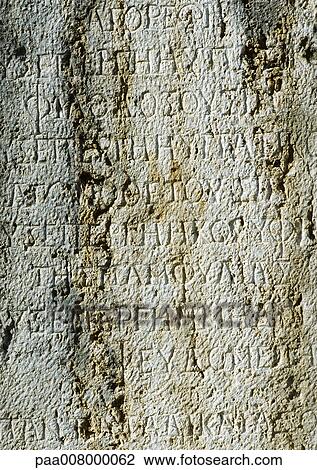 Ancient Greek manuscript engraved in stone. View Large Photo Image Stock Image - Ancient Greek manuscript engraved in stone.. Fotosearch