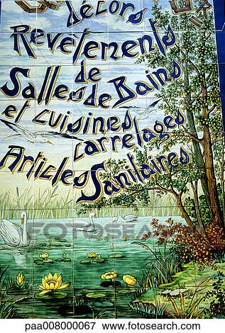 Stock Photo - Decorative painting on tile wall with French typography. Fotosearch