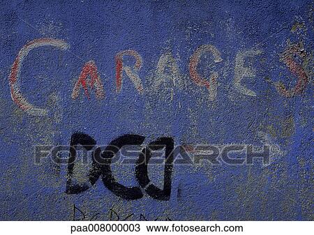 Garages type painted on blue wall. View Large Photo Image Stock Image - Garages type painted on blue wall.. Fotosearch