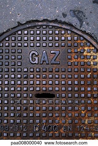 Gas type in French on man hole cover. View Large Photo Image Stock Image - Gas type in French on man hole cover.. Fotosearch