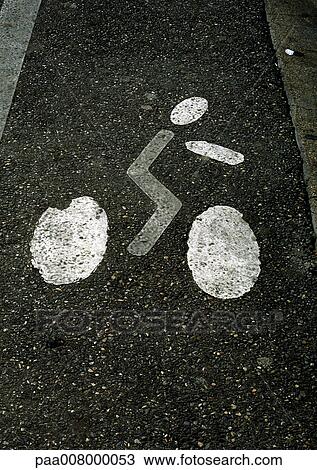 Painting of bicyclist on street. View Large Photo Image Stock Image - Painting of bicyclist on street.. Fotosearch