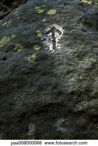 Stenciled arrow on stone. View Large Photo Image Stock Photo - Stenciled arrow on stone.. Fotosearch