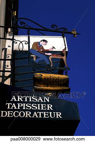 Stock Photo - Upholsterer shop sign in French. Fotosearch