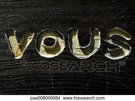 You typography in French engraved in wood. View Large Photo Image Picture - You typography in French engraved in wood.. Fotosearch