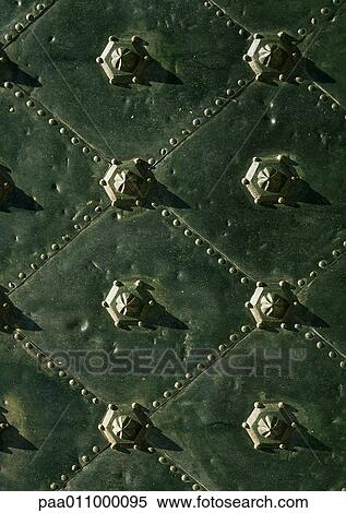 Bronze door with studs, close-up View Large Photo Image Stock Photography - Bronze door with studs, close-up. Fotosearch