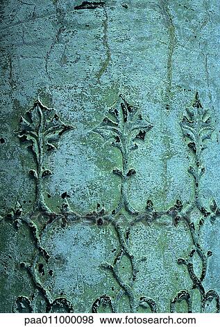 Floral motif sculpted on bluish surface View Large Photo Image Stock Photo - Floral motif sculpted on bluish surface. Fotosearch