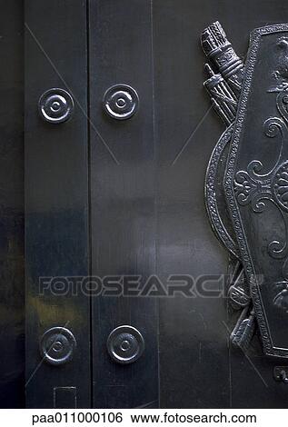 Section of metal door with coat of arms, close-up View Large Photo Image Stock Photograph - Section of metal door with coat of arms, close-up. Fotosearch