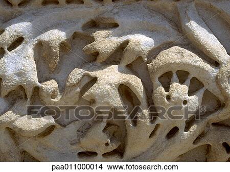 Stone carving with floral motif, worn away, close-up View Large Photo Image Picture - Stone carving with floral motif, worn away, close-up. Fotosearch