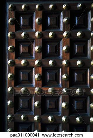 Wood door with brass studs, close-up View Large Photo Image Stock Image - Wood door with brass studs, close-up. Fotosearch