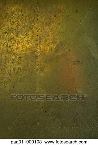 Stock Photo - Yellowish metal surface, close-up. Fotosearch