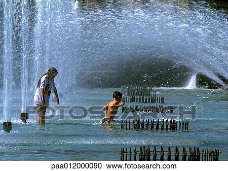 Stock Image - Children in fountain. Fotosearch