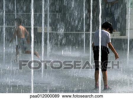 Stock Photo - Children in fountain. Fotosearch