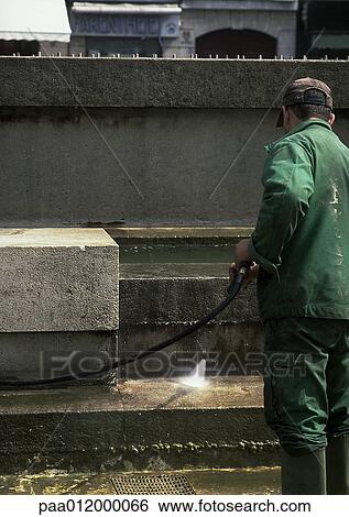 Man hosing off steps View Large Photo Image Stock Photograph - Man hosing off steps. Fotosearch