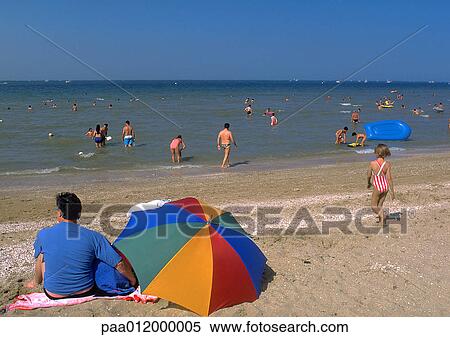 Stock Photography - People at beach. Fotosearch