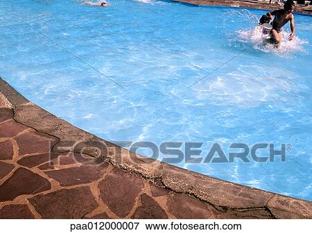 Stock Photo - People in swimming pool. Fotosearch