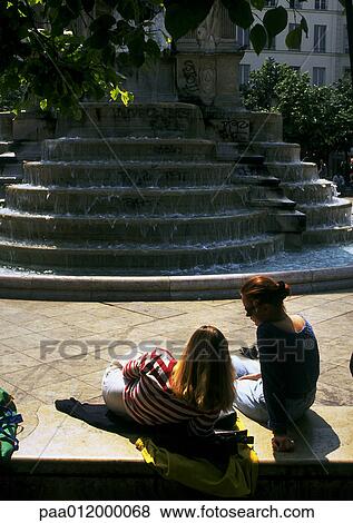 People lounging near fountain View Large Photo Image Stock Photo - People lounging near fountain. Fotosearch