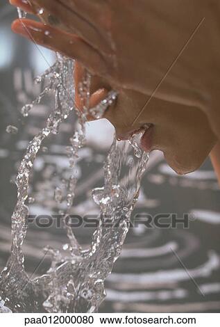 Person splashing water on face, close-up View Large Photo Image Stock Image - Person splashing water on face, close-up. Fotosearch